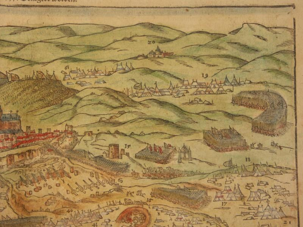 Ein historisches Buch mit einer detaillierten Karte von Düsseldorf unter Belagerung, mit Gebäuden, Hügeln und Text auf der Seite.