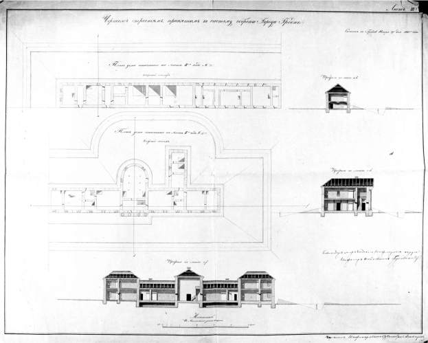 Eine Schwarz-Weiß-Zeichnung eines Gebäudes mit zahlreichen Fenstern, wahrscheinlich ein Grundriss für eine neue Schule, mit detaillierten Plänen und Texten zur Gebäudeaufteilung.